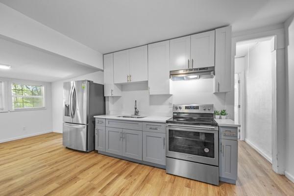 1339 Lyle Avenue Atlanta, GA 30344 - Photo 5 of 21 a kitchen with a stove top oven and refrigerator