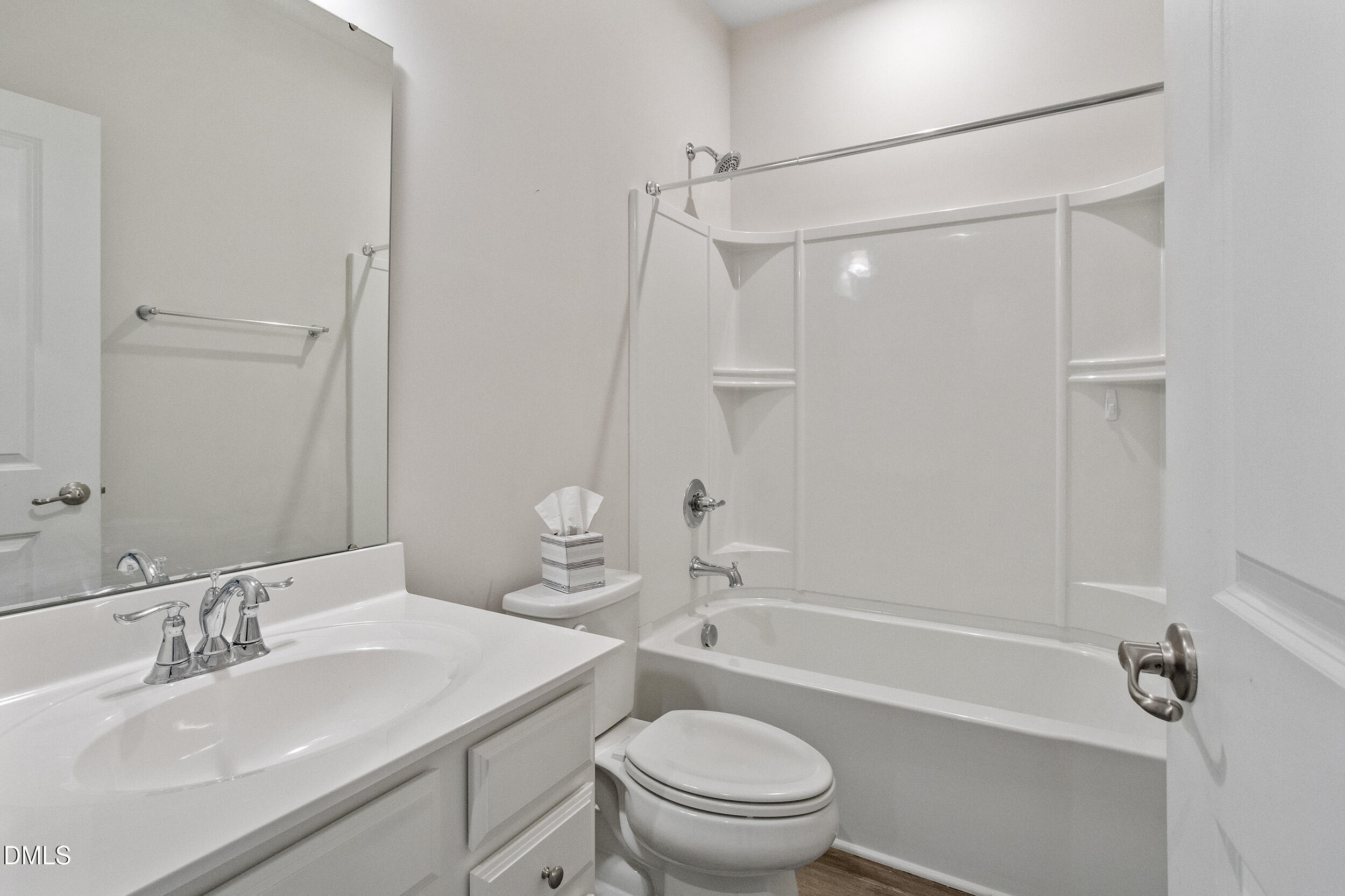 1124 Platform Drive Apex, NC 27502 - Photo 19 of 34 a bathroom with a sink a toilet and a mirror