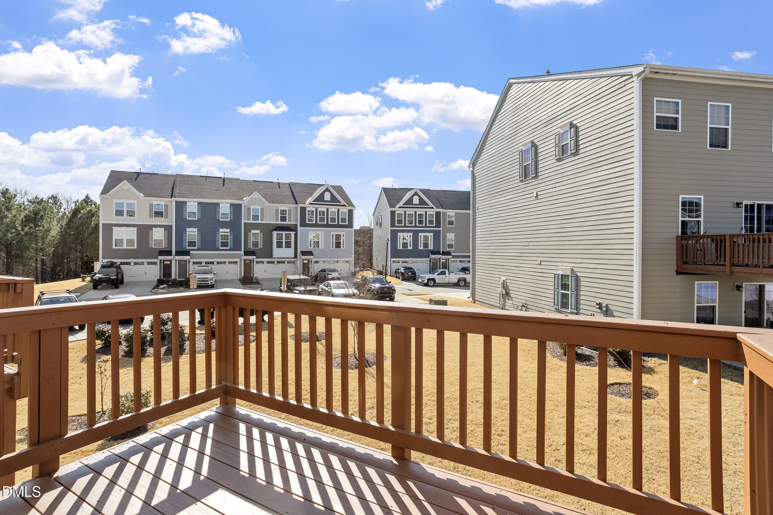1124 Platform Drive Apex, NC 27502 - Photo 31 of 34 a view of a balcony with wooden floor and fence