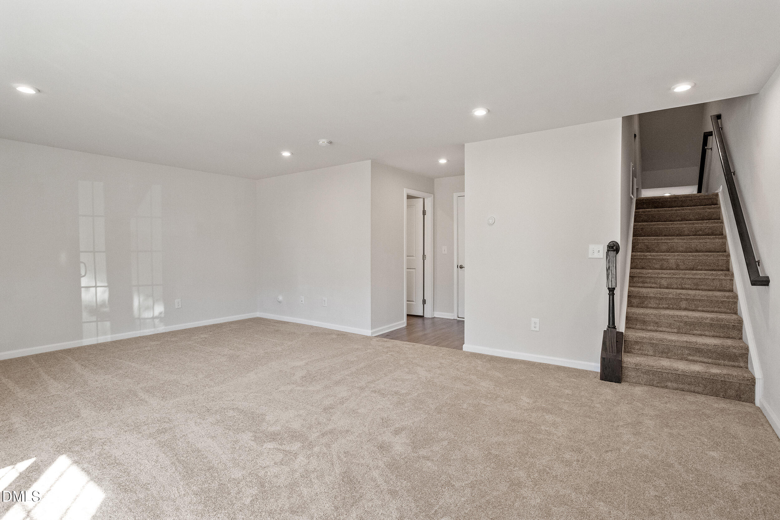 1124 Platform Drive Apex, NC 27502 - Photo 5 of 34 a view of an empty room with stairs