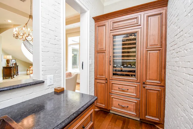 a kitchen with granite countertop a sink and a stove