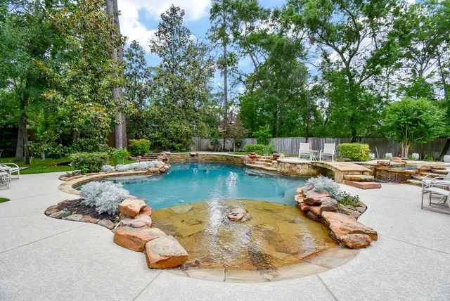 a view of swimming pool with chairs