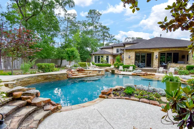 a view of a swimming pool with sitting area