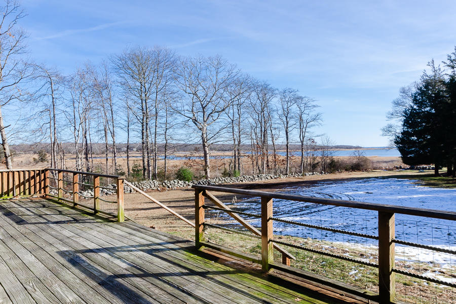a view of a wooden deck with trees