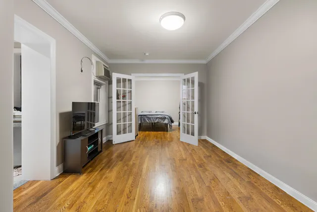 a view of a livingroom with furniture a ceiling fan and wooden floor