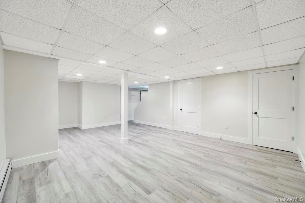 160 Oak Street Mattituck, NY 11952 - Photo 18 of 29 a view of an empty room with wooden floor