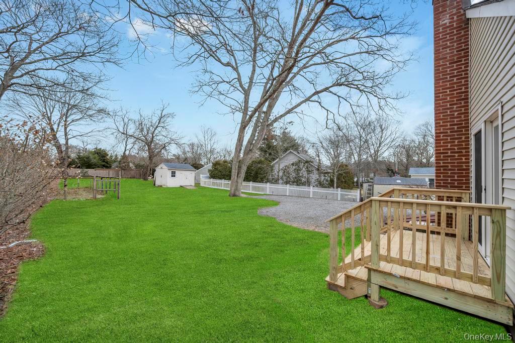 160 Oak Street Mattituck, NY 11952 - Photo 26 of 29 a view of garden with wooden deck