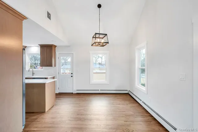 a kitchen with stainless steel appliances a refrigerator stove and sink