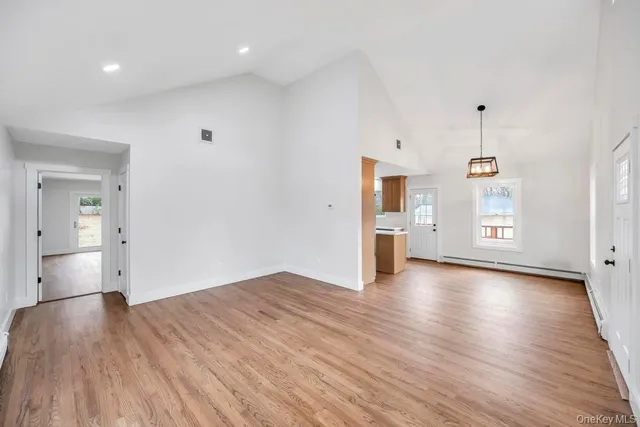 a kitchen that has a sink a stove counter top space and cabinets