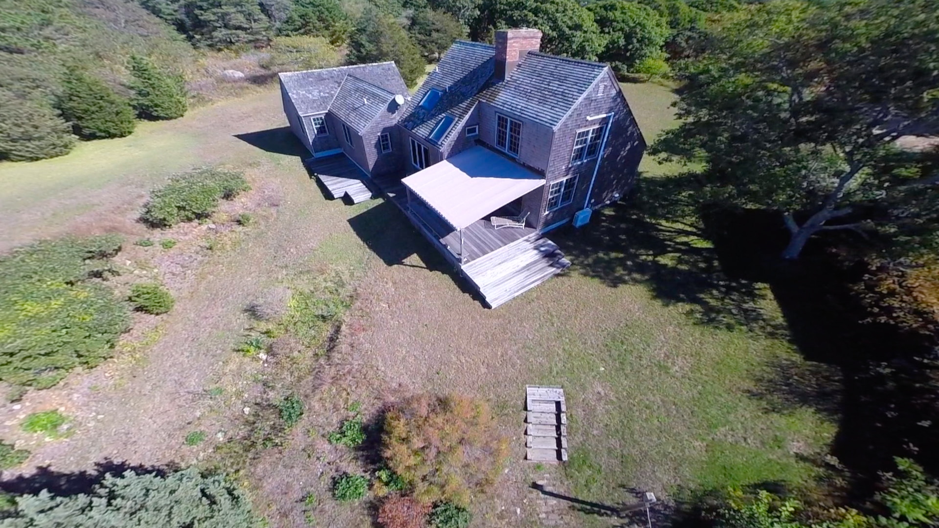 24 Calebs Pond Road Edgartown, MA 02539 - Photo 14 of 14 an aerial view of a house with garden space and street view