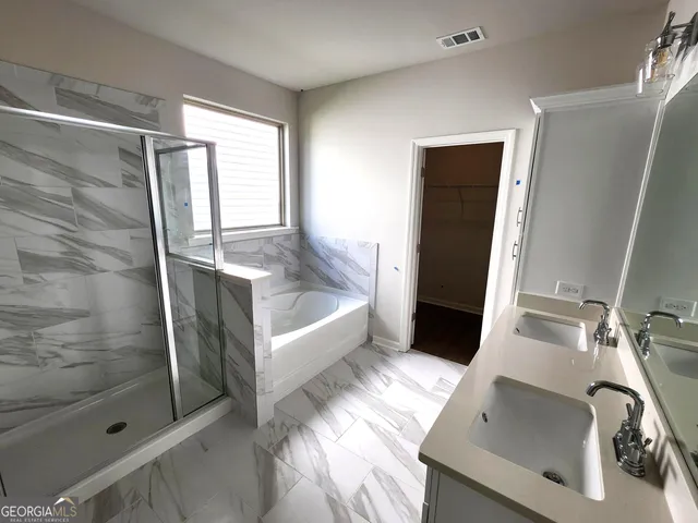a bathroom with a sink and a tub