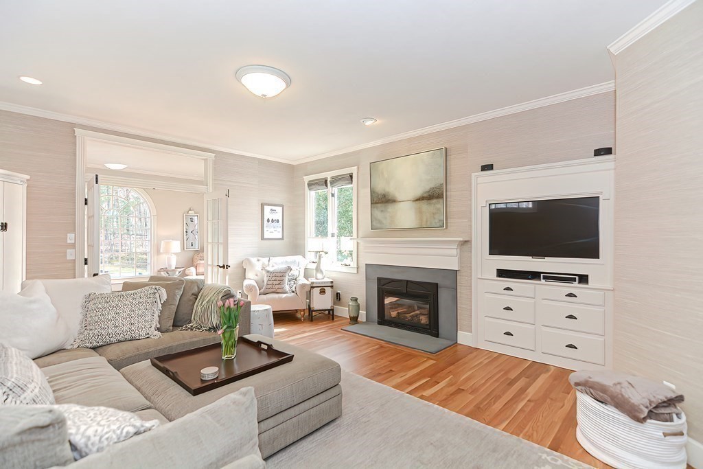 17 Elizabeth Road Hopkinton, MA 01748 - Photo 14 of 40 a living room with furniture a fireplace and a flat screen tv