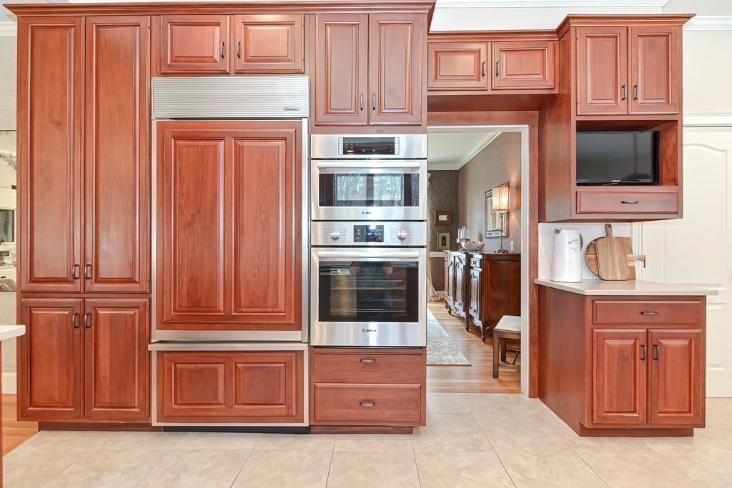 17 Elizabeth Road Hopkinton, MA 01748 - Photo 19 of 40 a kitchen with stainless steel appliances granite countertop a refrigerator and cabinets
