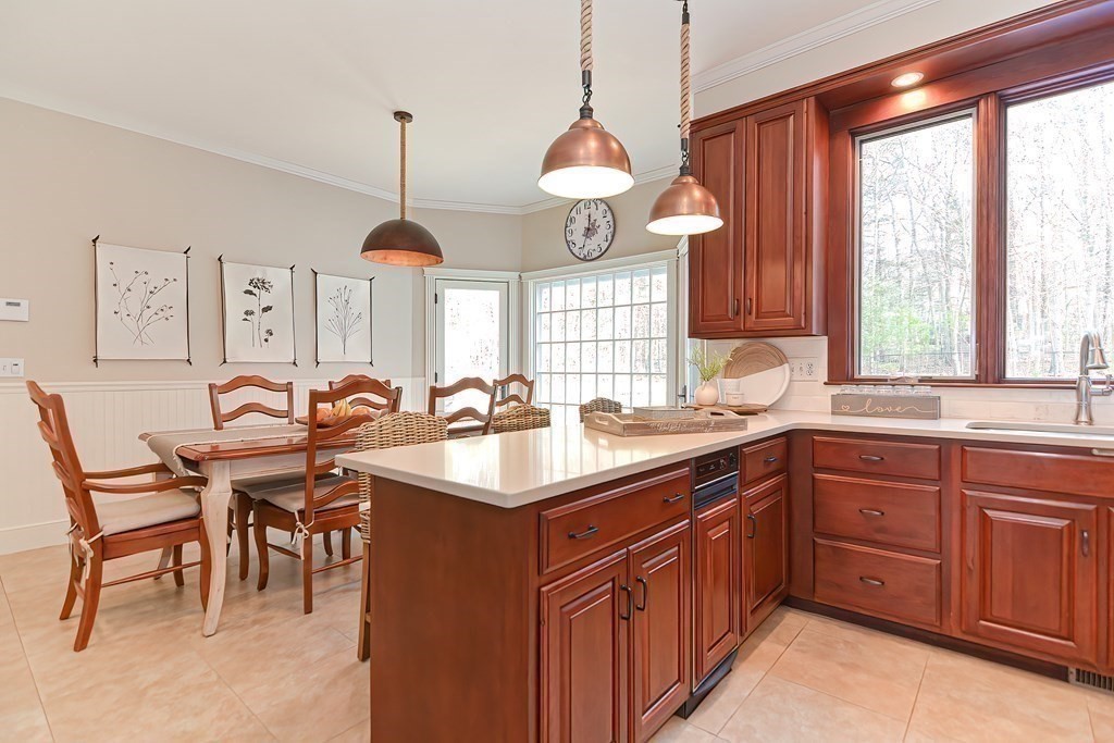 17 Elizabeth Road Hopkinton, MA 01748 - Photo 20 of 40 a kitchen with lots of counter space windows and chairs