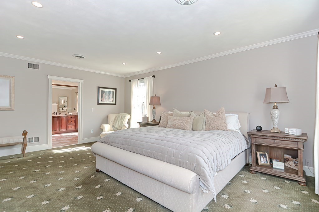 17 Elizabeth Road Hopkinton, MA 01748 - Photo 25 of 40 a spacious bedroom with a bed and wooden floor