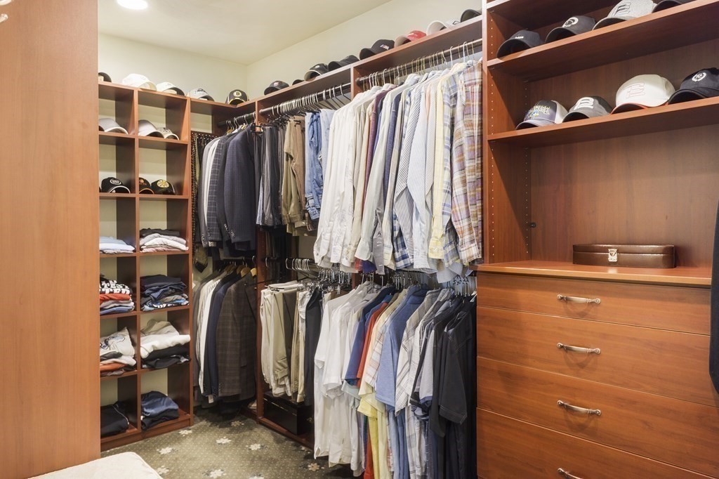 17 Elizabeth Road Hopkinton, MA 01748 - Photo 27 of 40 a view of walk in closet with clothes and shoes