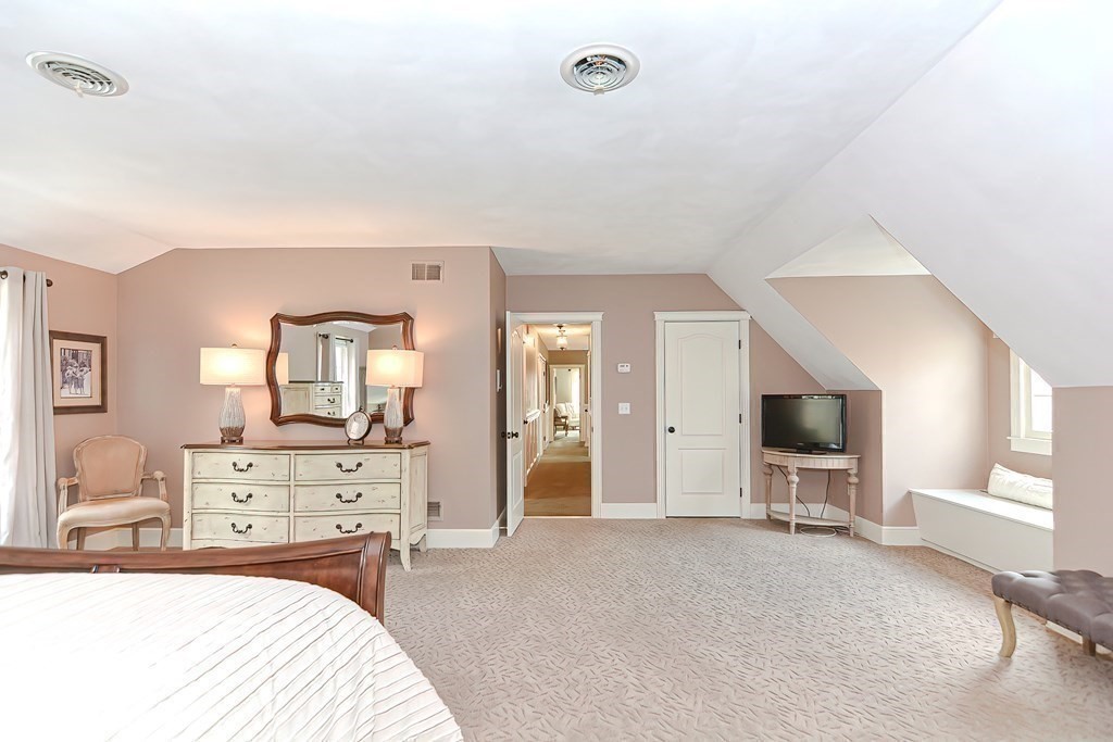 17 Elizabeth Road Hopkinton, MA 01748 - Photo 35 of 40 a bedroom with a bed and a flat tv screen on the dresser