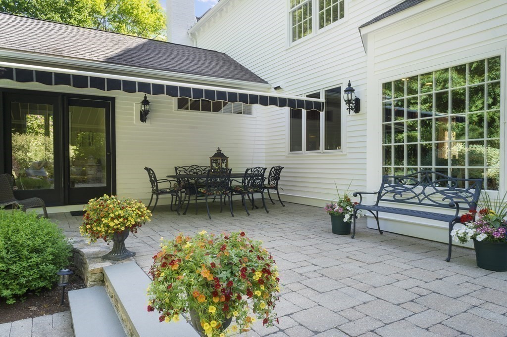 17 Elizabeth Road Hopkinton, MA 01748 - Photo 38 of 40 a view of a patio with table and chairs and potted plants
