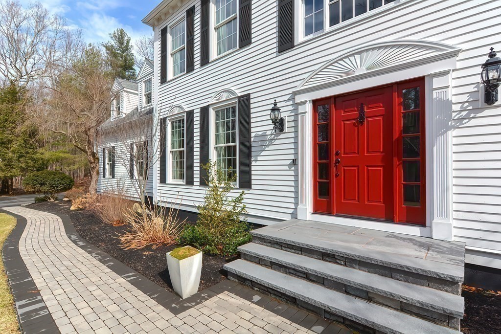 17 Elizabeth Road Hopkinton, MA 01748 - Photo 40 of 40 a view of a house with a chair and potted plant
