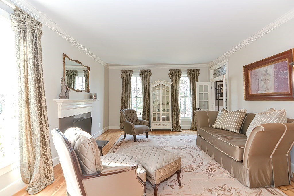 17 Elizabeth Road Hopkinton, MA 01748 - Photo 7 of 40 a living room with furniture fireplace and a large window