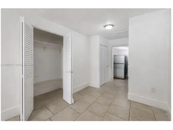 a view of an empty room and fire place