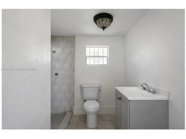 a bathroom with a toilet and a sink