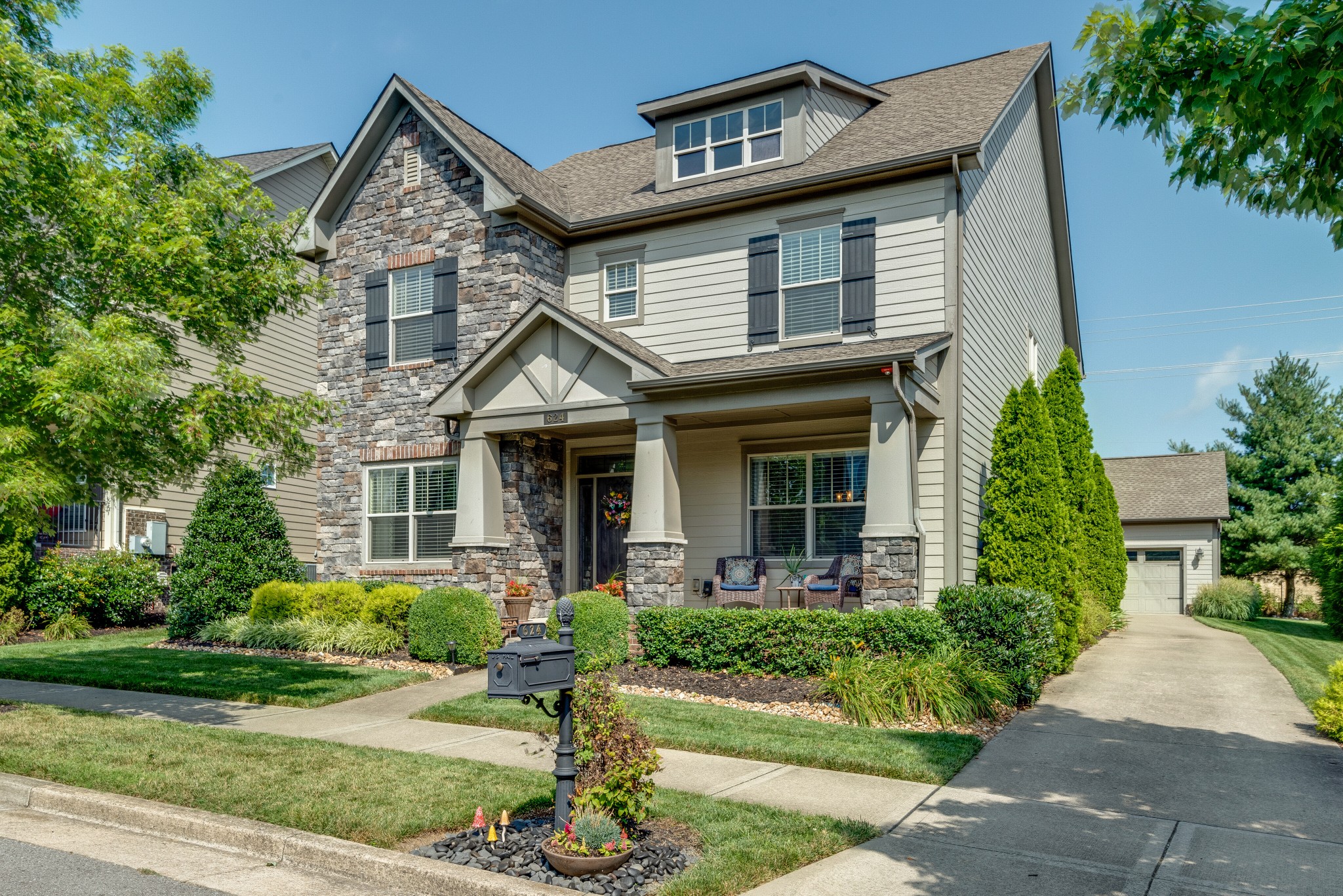 624 Streamside Lane Franklin, TN 37064 - Photo 1 of 33 a front view of a house with a yard