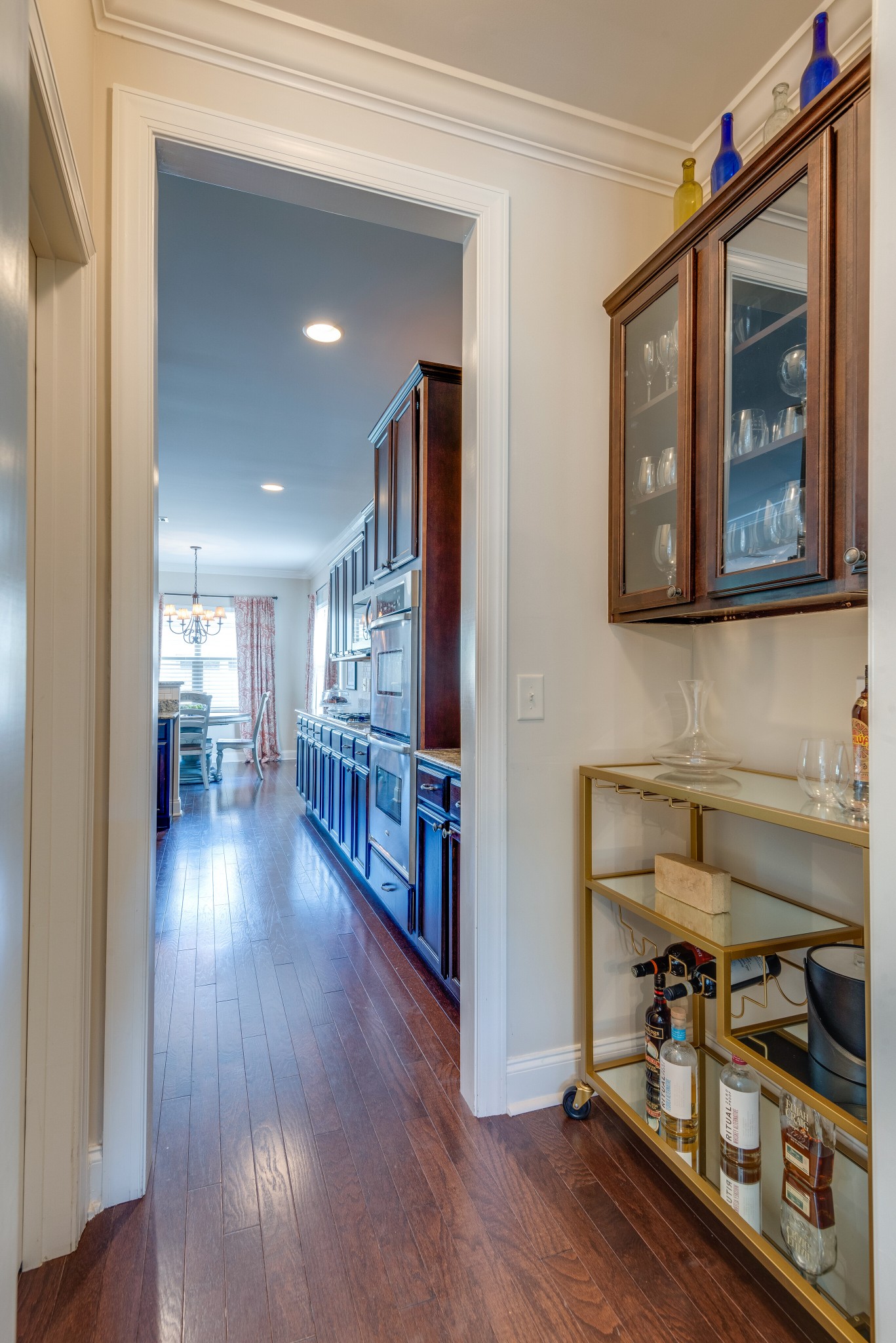 624 Streamside Lane Franklin, TN 37064 - Photo 13 of 33 a view of a hallway with wooden floor windows and a living room