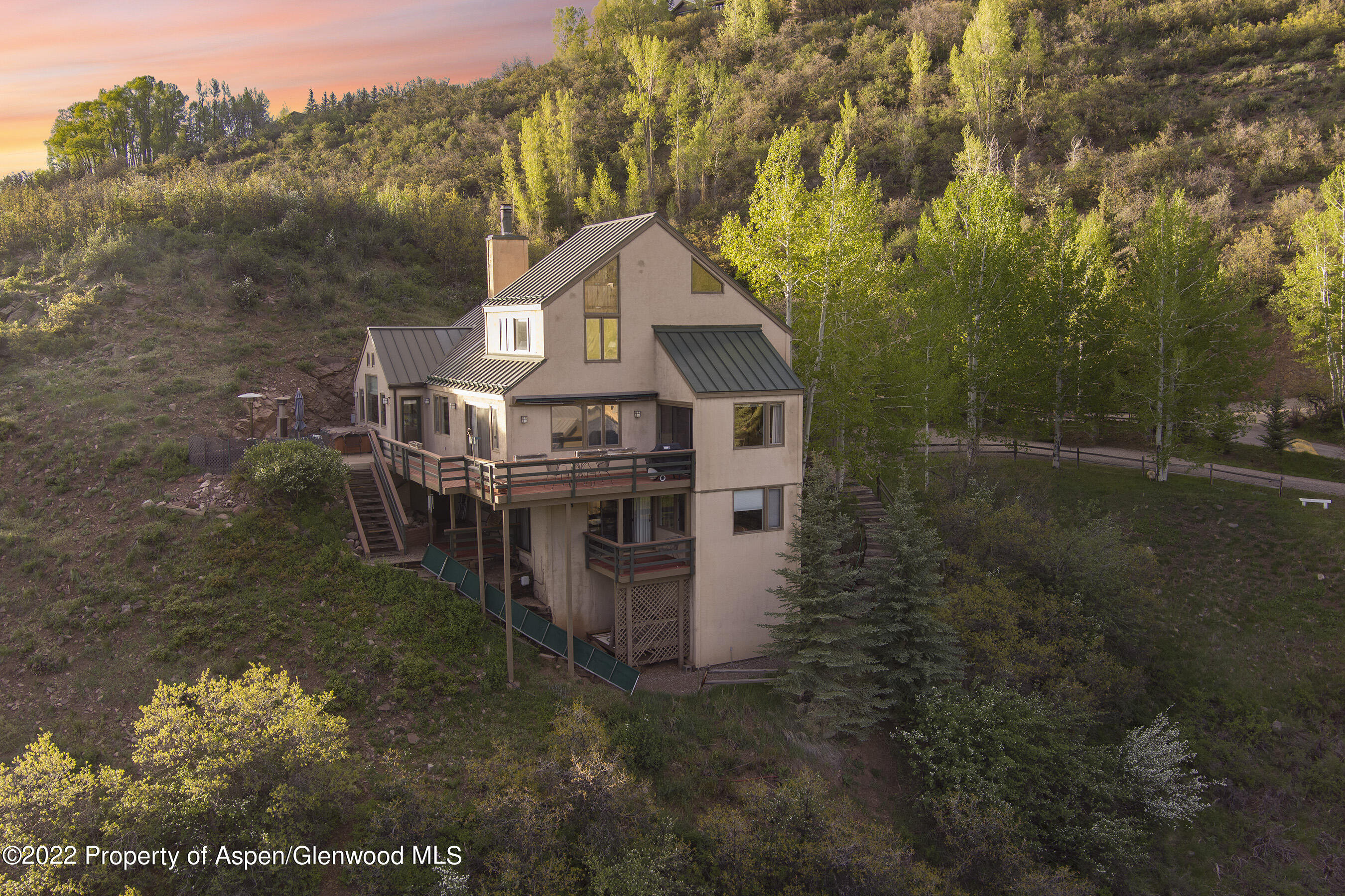 376 Draw Drive Aspen, CO 81612 - Photo 14 of 34 a view of a house with a small yard and large trees