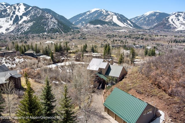 a view of a backyard with sitting area