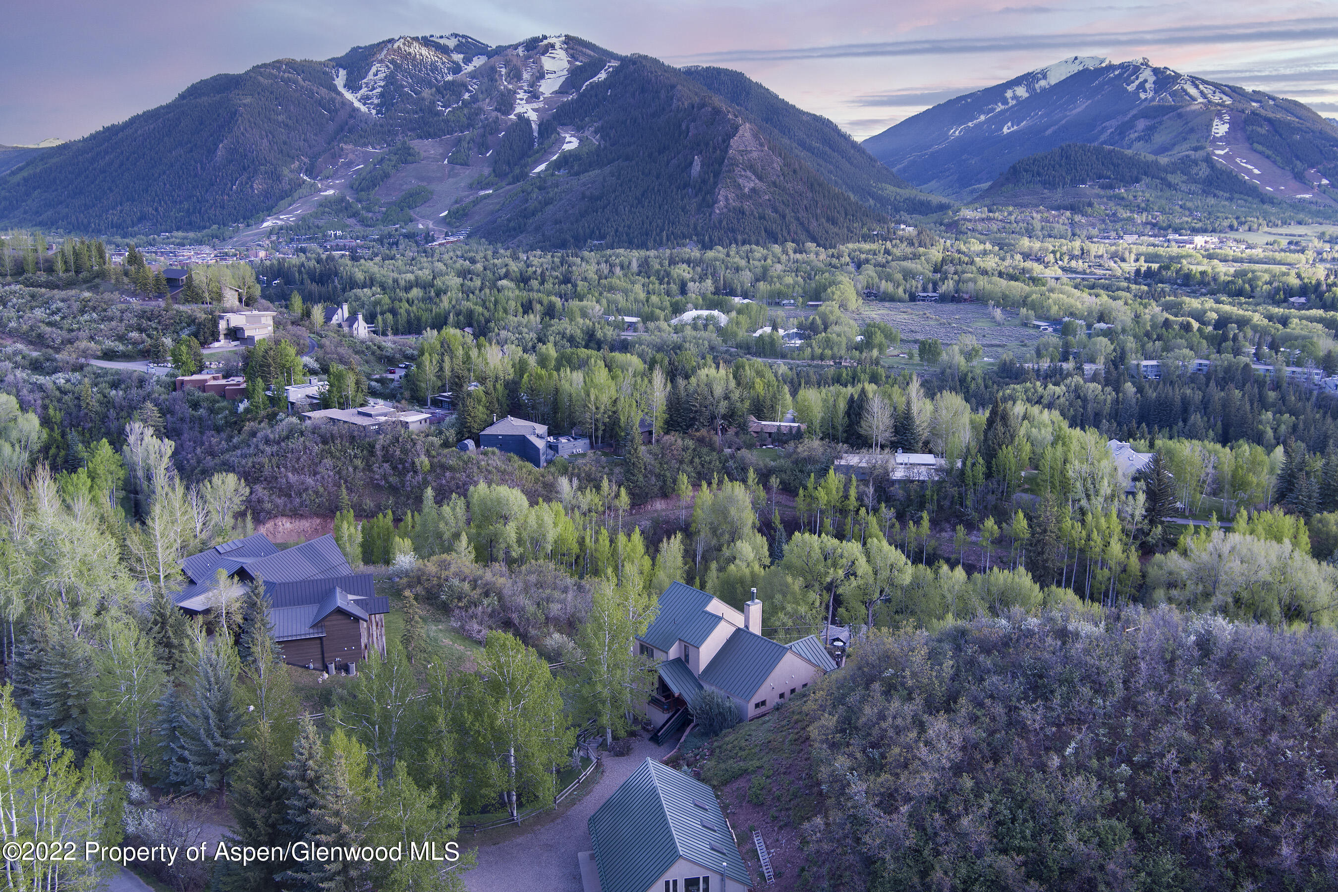 376 Draw Drive Aspen, CO 81612 - Photo 28 of 34 a view of a lush green hillside and a building