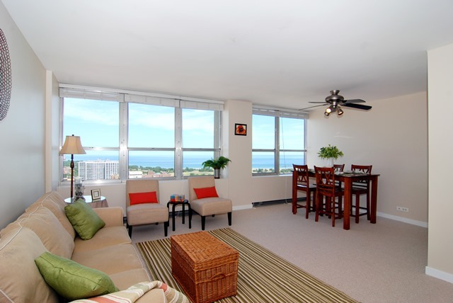 655 West Irving Park Road, Unit 3614 Chicago, IL 60613 - Photo 4 of 10 a living room with furniture and a large window