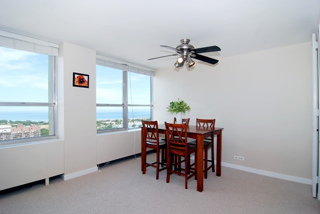 655 West Irving Park Road, Unit 3614 Chicago, IL 60613 - Photo 7 of 10 a view of a dining room with furniture and window