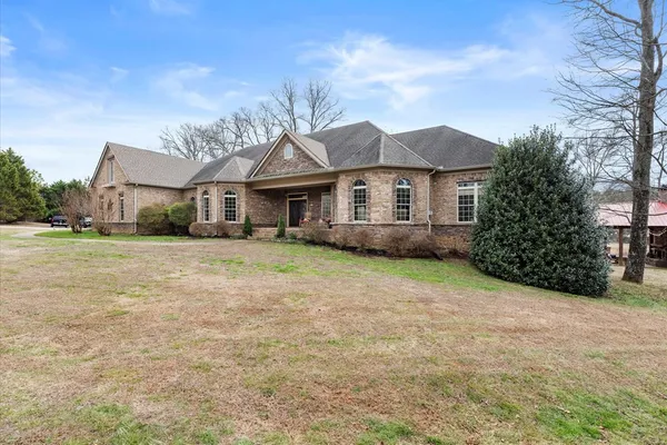 a view of living room and kitchen with wooden floor