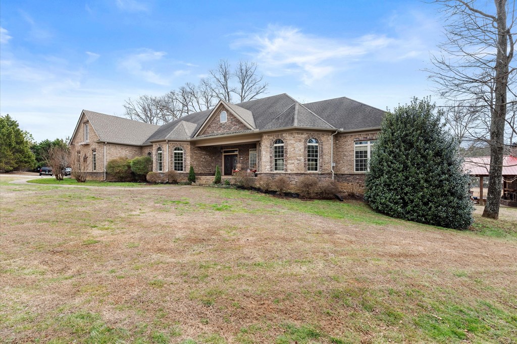 456 East Valley Road Northeast Rydal, GA 30171 - Photo 12 of 98 a front view of a house with a garden