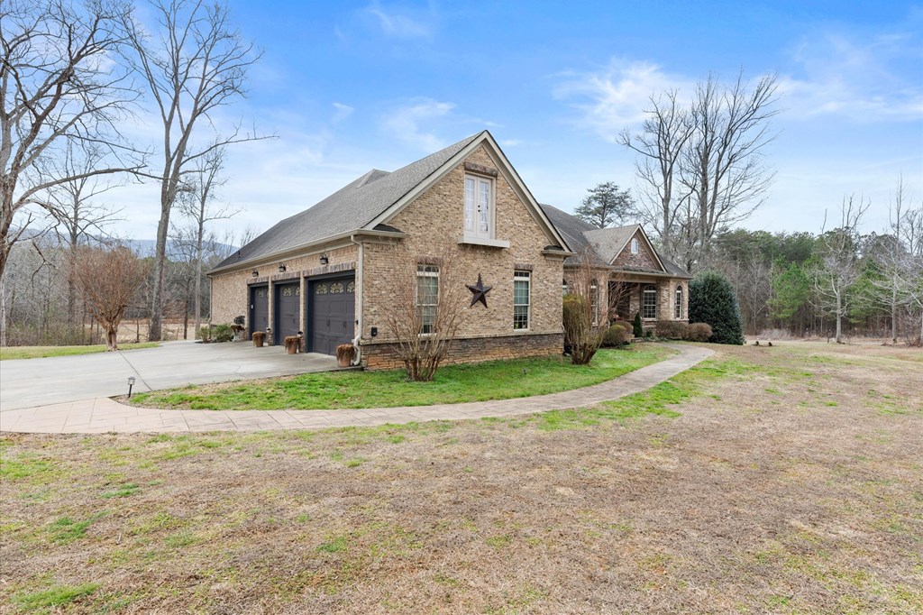 456 East Valley Road Northeast Rydal, GA 30171 - Photo 13 of 98 a view of a big house with a big yard and large trees