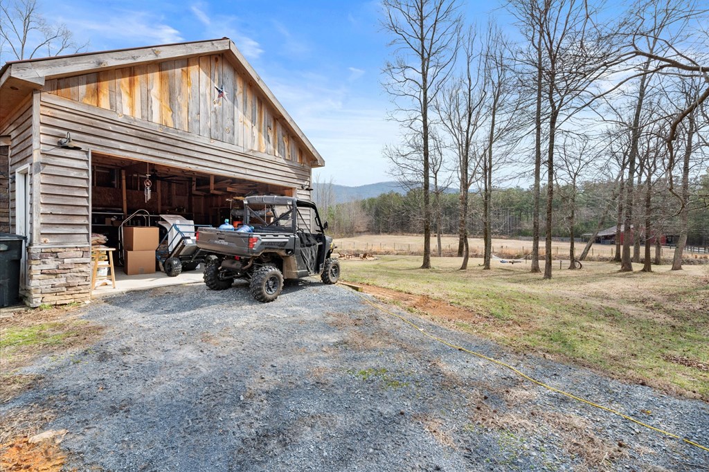 456 East Valley Road Northeast Rydal, GA 30171 - Photo 25 of 98 a view of a house with large space and a car park side of road
