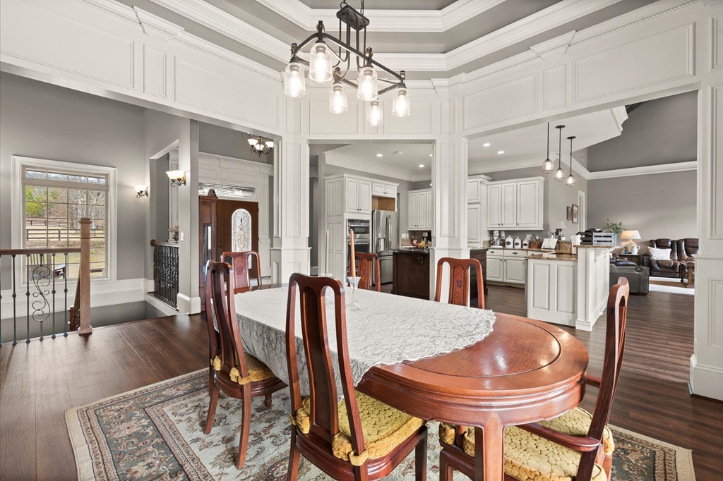 456 East Valley Road Northeast Rydal, GA 30171 - Photo 49 of 98 a view of a dining room and livingroom with furniture wooden floor a chandelier