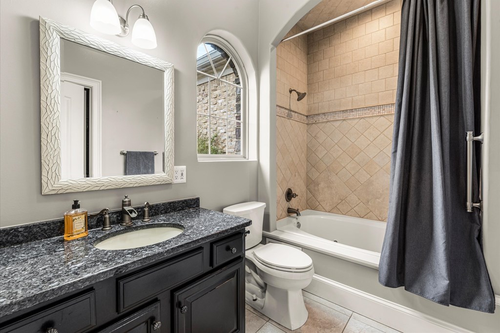456 East Valley Road Northeast Rydal, GA 30171 - Photo 56 of 98 a bathroom with a granite countertop sink toilet and shower