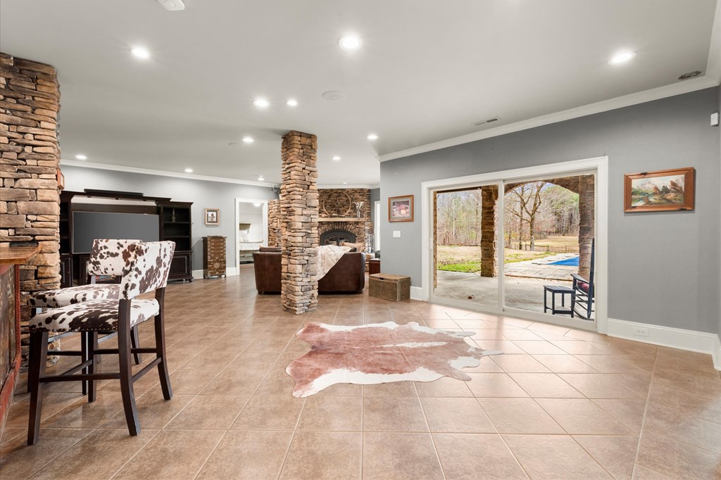 456 East Valley Road Northeast Rydal, GA 30171 - Photo 72 of 98 a living room with furniture a large window and a flat screen tv