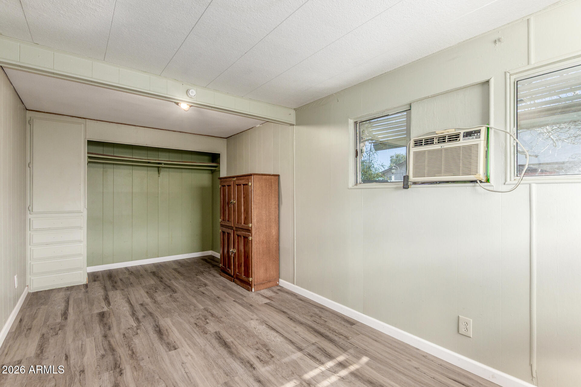 6633 West Nancy Road Glendale, AZ 85306 - Photo 17 of 29 a view of empty room with wooden floor