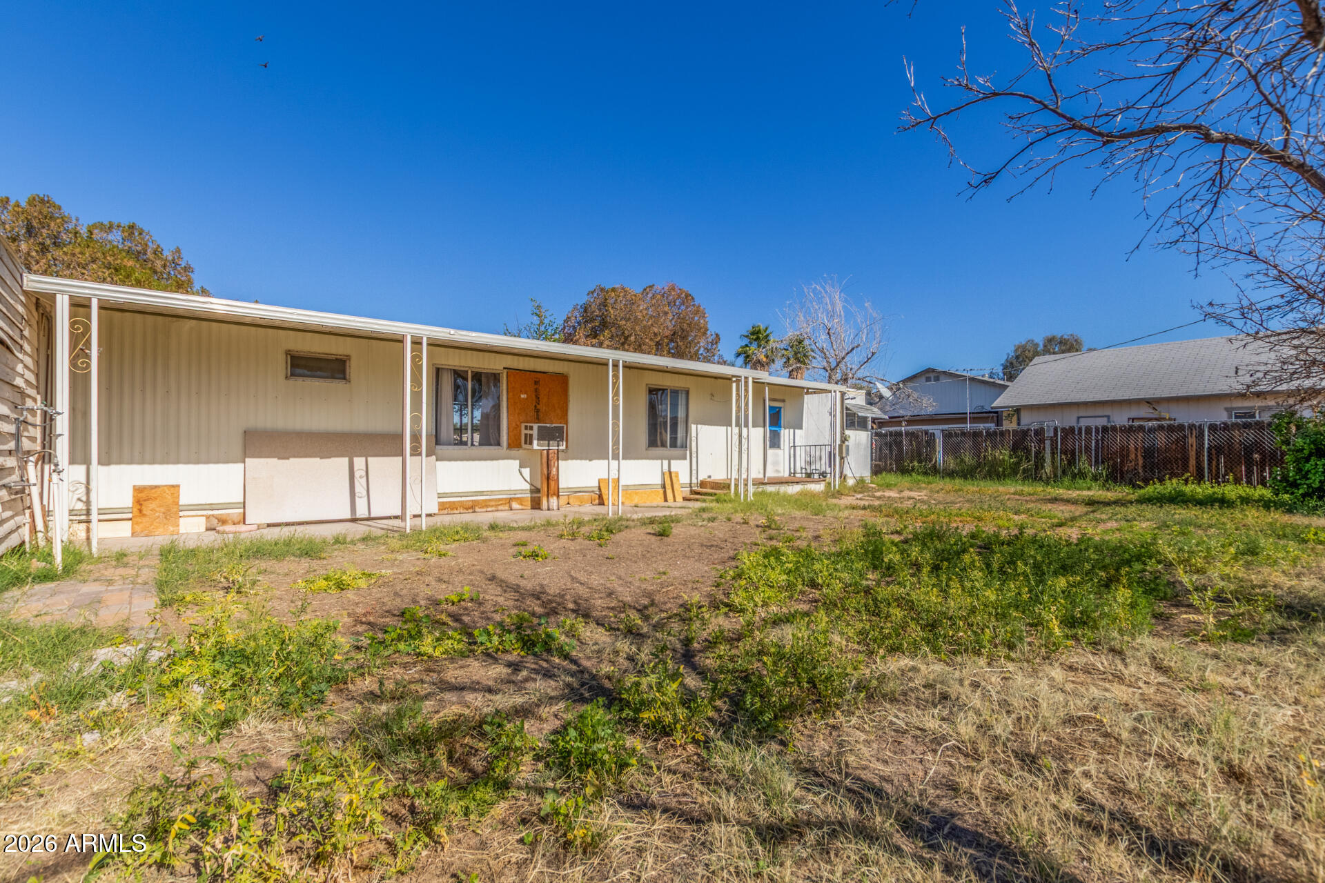 6633 West Nancy Road Glendale, AZ 85306 - Photo 23 of 29 a front view of a house with a yard