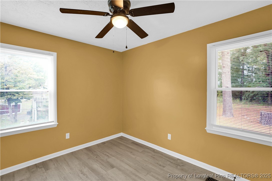 2218 Chason Road Lumber Bridge, NC 28357 - Photo 18 of 22 a view of an empty room with a window and a ceiling fan