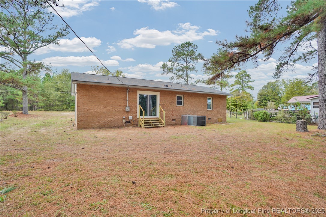 2218 Chason Road Lumber Bridge, NC 28357 - Photo 20 of 22 a front view of house with a yard and garage