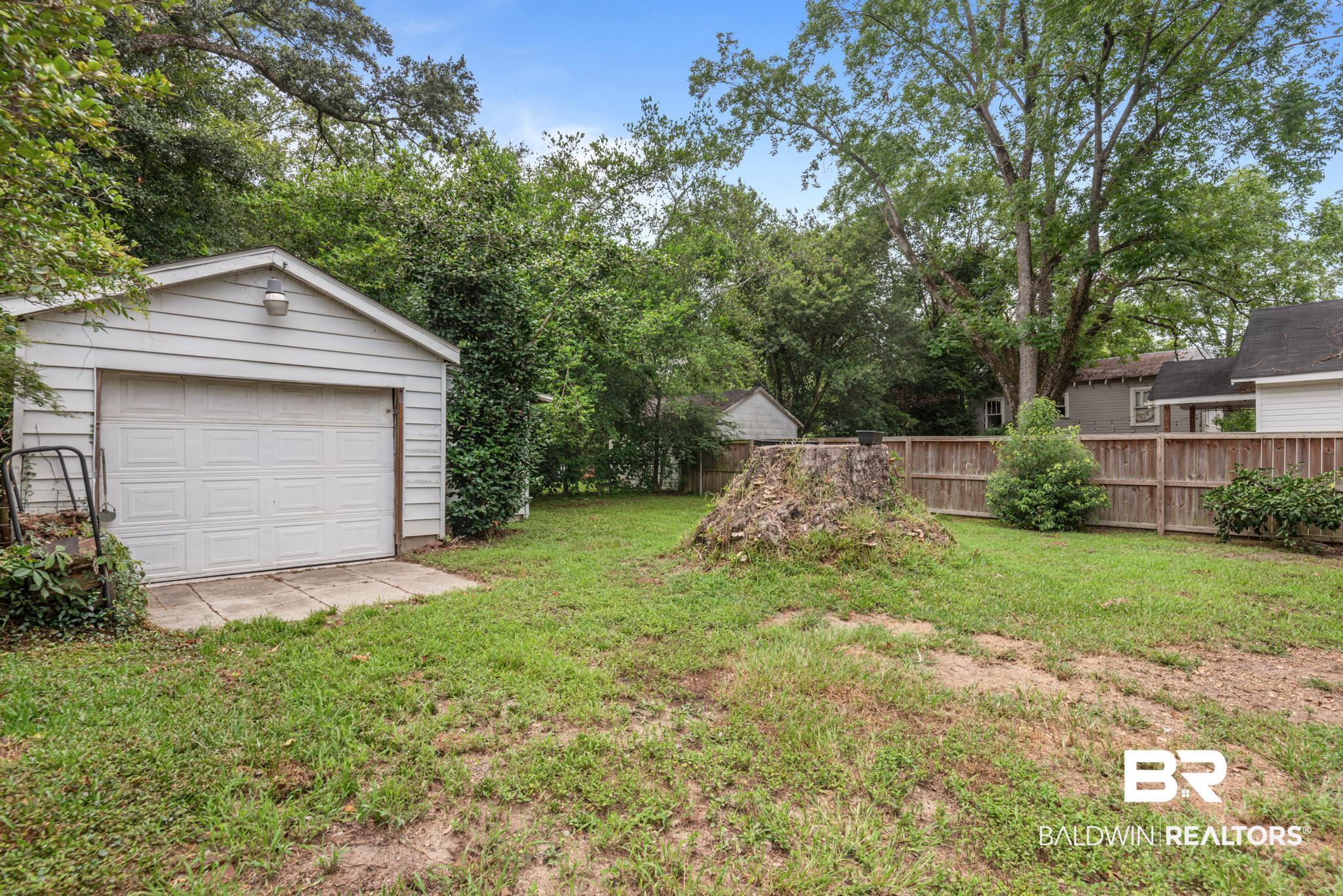 114 Crenshaw Street Mobile, AL 36606 - Photo 47 of 49 View of yard with an outdoor structure and a garage