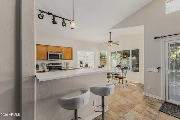 a dining room with furniture and a chandelier