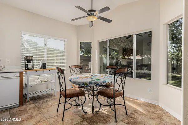 a view of a dining room with furniture window and outside view