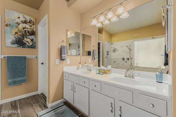 a bathroom with a double vanity sink mirror and double