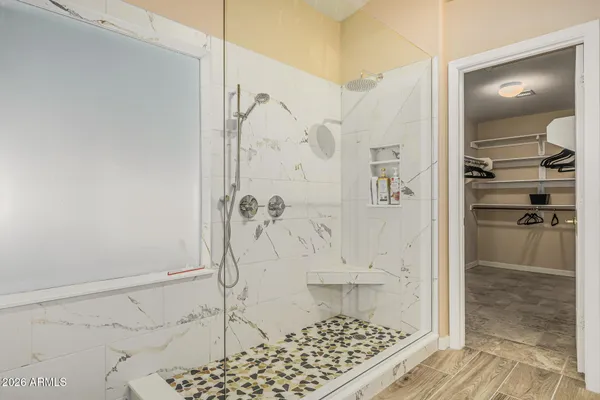 a bathroom with a shower and a sink