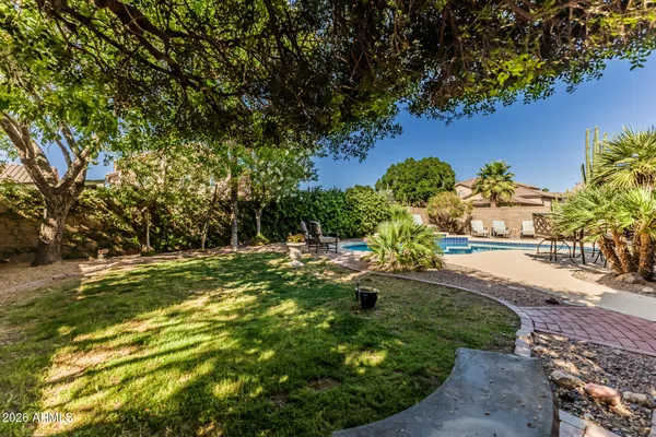 a view of a house with a yard porch and sitting area